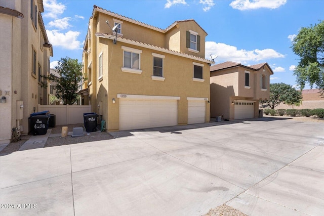 view of side of property featuring a garage