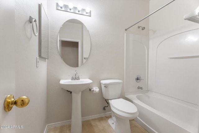 bathroom featuring toilet and shower / bathtub combination