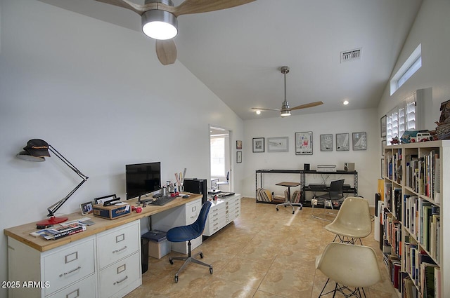 office with light tile patterned floors, visible vents, high vaulted ceiling, and ceiling fan