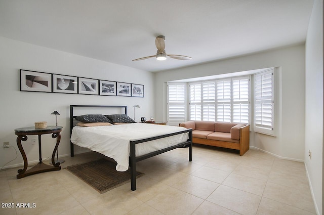 bedroom with light tile patterned floors, baseboards, and a ceiling fan