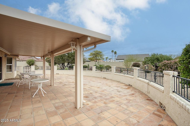 view of patio / terrace with outdoor dining space and fence