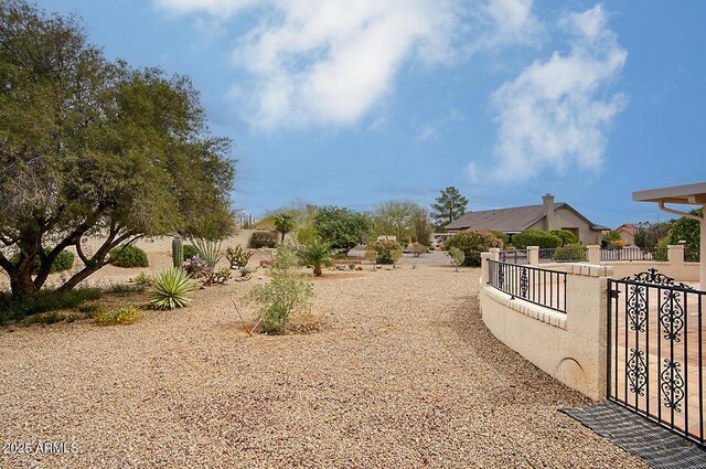 view of yard with a gate and fence