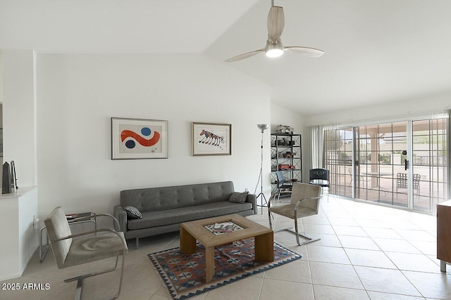 tiled living room featuring lofted ceiling and ceiling fan