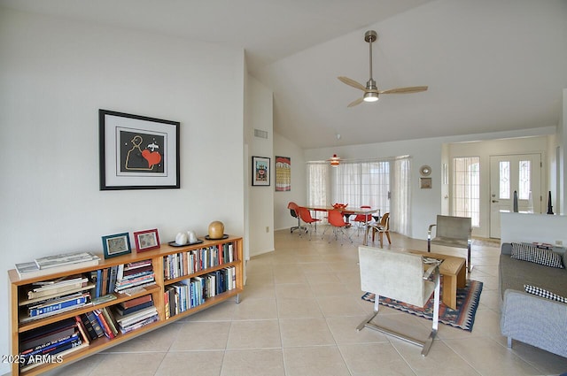 tiled living room with visible vents, a ceiling fan, and vaulted ceiling