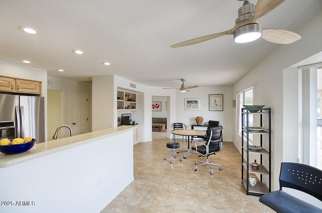 interior space featuring recessed lighting, visible vents, built in shelves, and ceiling fan