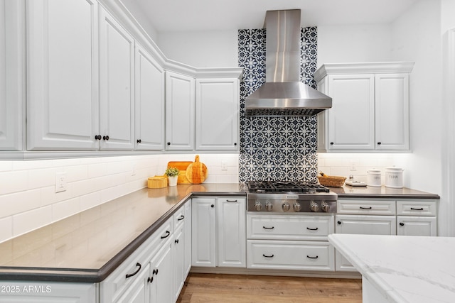 1948 W Paso Trl, Phoenix, AZ 85085 - kitchen with wall chimney range hood, stainless steel gas stovetop, white cabinets, and tasteful backsplash