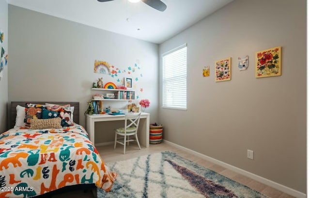 bedroom with baseboards and a ceiling fan