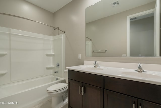 full bath with double vanity, visible vents, toilet, and a sink
