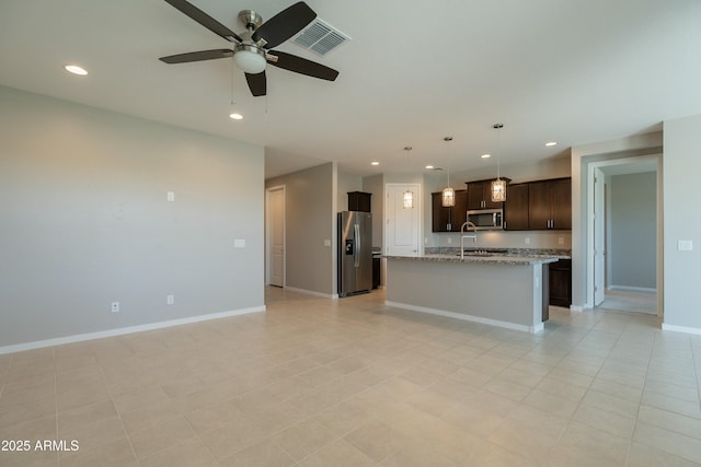 kitchen with recessed lighting, stainless steel appliances, ceiling fan, visible vents, and open floor plan