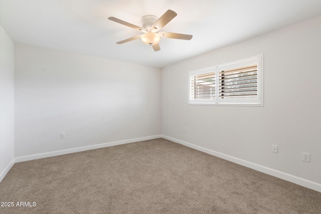 unfurnished room featuring baseboards, a ceiling fan, and carpet flooring