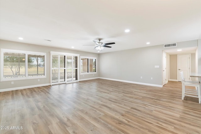 unfurnished living room with light wood-style floors, recessed lighting, visible vents, and baseboards