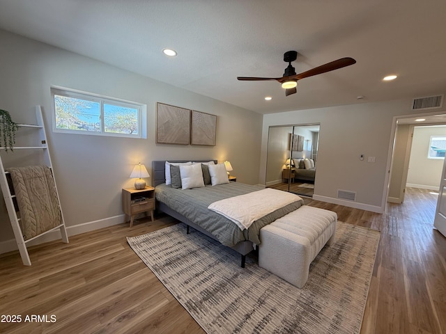 bedroom with visible vents, a closet, and light wood-type flooring