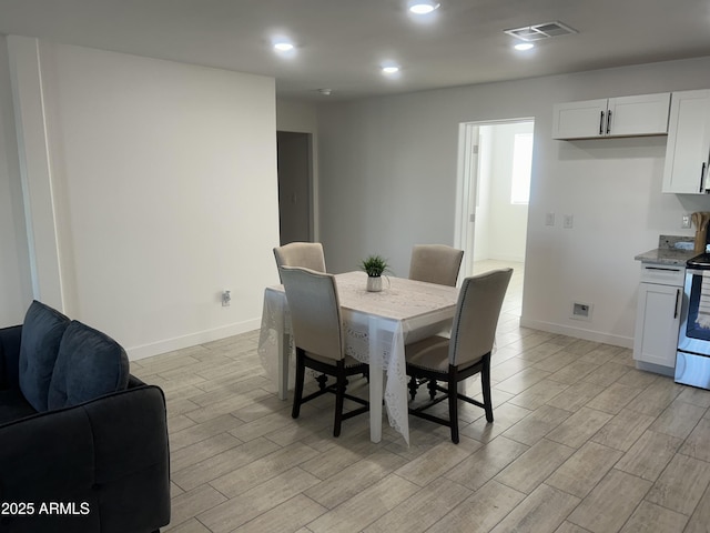 4602 N 47th Ave N, Phoenix, AZ 85031 - dining area featuring light wood finished floors, baseboards, and recessed lighting