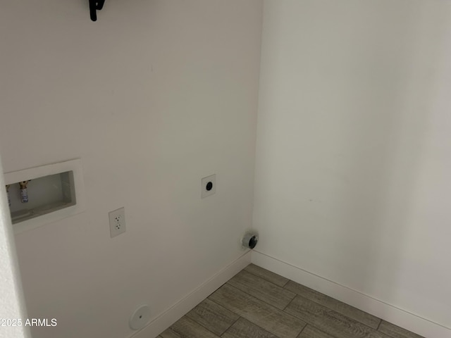 4602 N 47th Ave N, Phoenix, AZ 85031 - laundry room featuring electric dryer hookup, baseboards, and wood finished floors