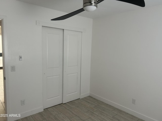 4602 N 47th Ave N, Phoenix, AZ 85031 - unfurnished bedroom with a closet, baseboards, and wood finished floors
