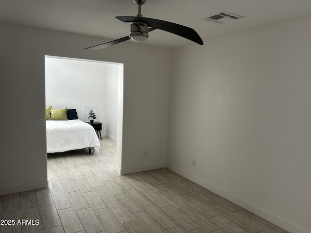 4602 N 47th Ave N, Phoenix, AZ 85031 - bedroom featuring wood finished floors, baseboards, and a ceiling fan