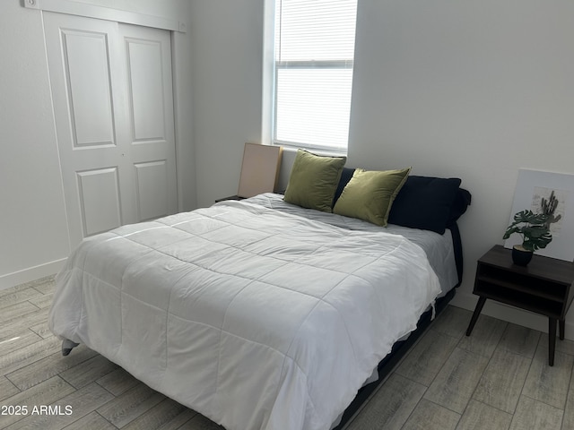 4602 N 47th Ave N, Phoenix, AZ 85031 - bedroom with wood finished floors, a closet, and baseboards
