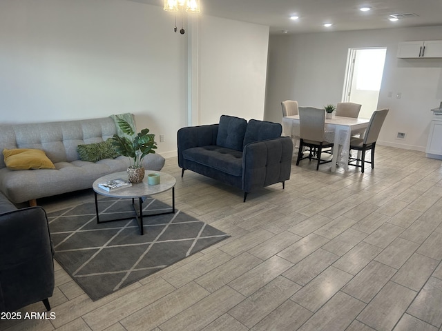 4602 N 47th Ave N, Phoenix, AZ 85031 - living room featuring light wood-style floors, baseboards, and recessed lighting