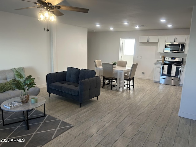 4602 N 47th Ave N, Phoenix, AZ 85031 - living area with light wood-style flooring, a ceiling fan, baseboards, and recessed lighting