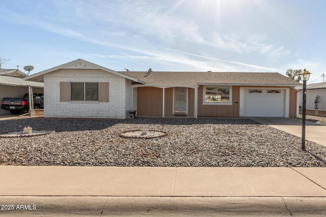 ranch-style house with a garage, brick siding, driveway, and a shingled roof