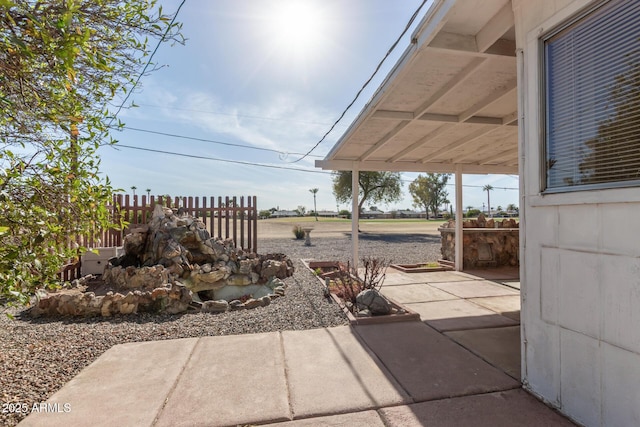 view of patio / terrace featuring fence