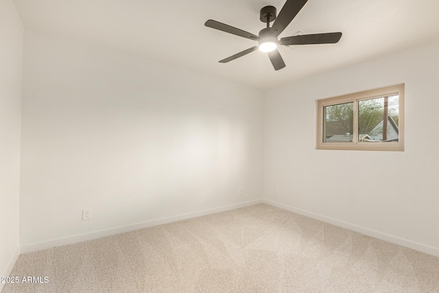 empty room featuring ceiling fan, carpet flooring, and baseboards