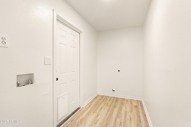 washroom featuring light wood-style flooring, laundry area, washer hookup, baseboards, and electric dryer hookup