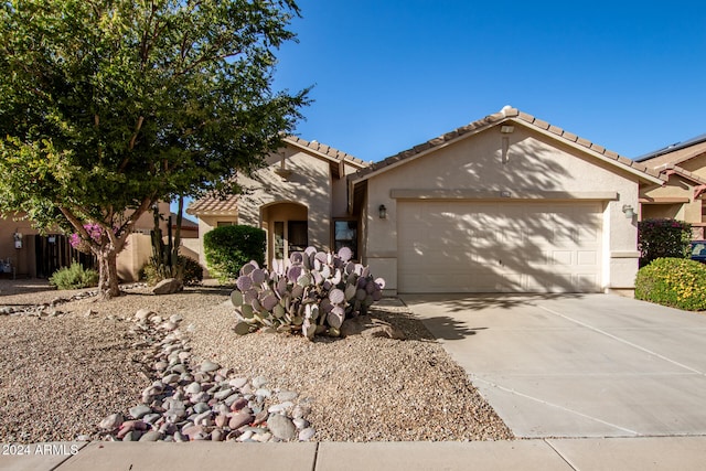 single story home with a garage