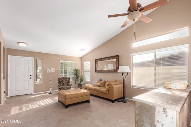 living room with high vaulted ceiling, light carpet, and ceiling fan