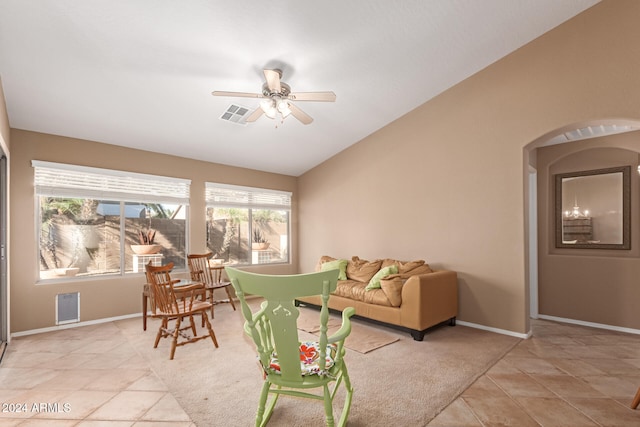 interior space with ceiling fan, plenty of natural light, and lofted ceiling