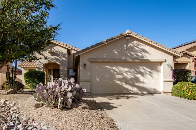 single story home featuring a garage