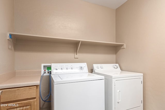 laundry area with independent washer and dryer