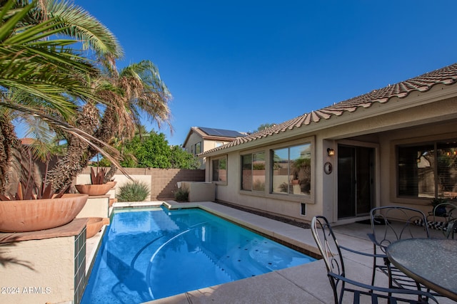 view of swimming pool featuring a patio area