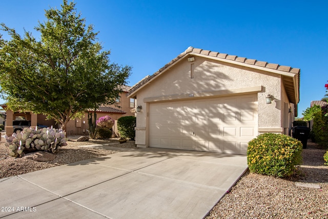 view of front of home with a garage