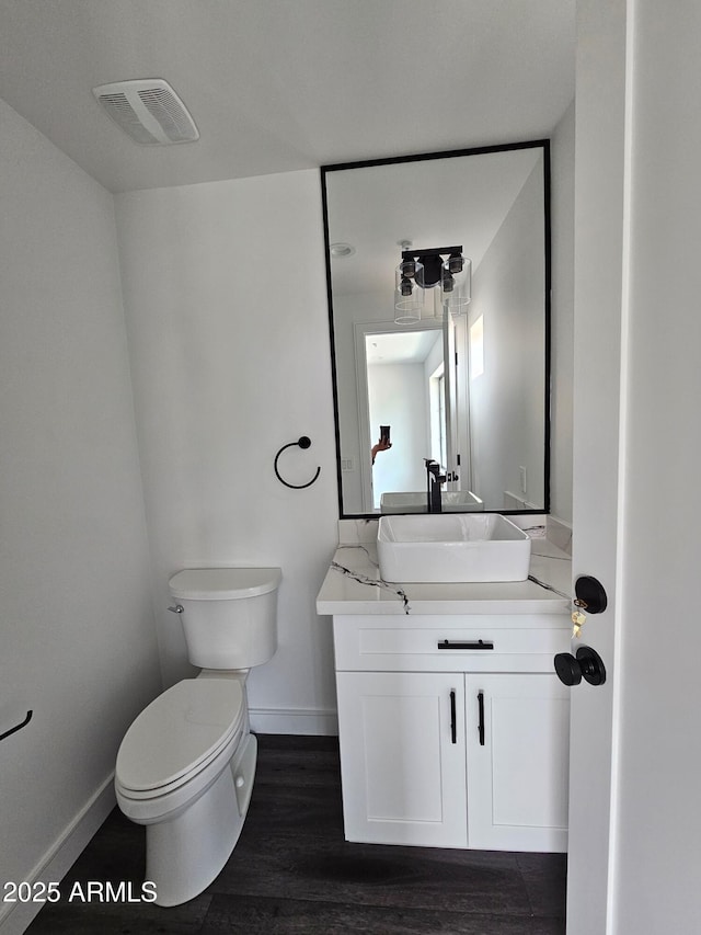 1401 S Rita Ln, Tempe, AZ 85281 - bathroom with vanity and wood finished floors