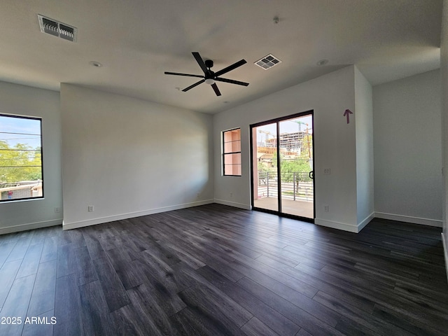 1401 S Rita Ln, Tempe, AZ 85281 - unfurnished room featuring healthy amount of natural light, dark wood-type flooring, and a ceiling fan