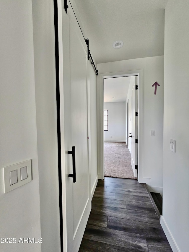 1401 S Rita Ln, Tempe, AZ 85281 - hallway featuring a barn door and dark wood-type flooring