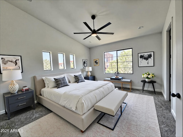 1401 S Rita Ln, Tempe, AZ 85281 - bedroom with multiple windows, lofted ceiling, dark carpet, and ceiling fan