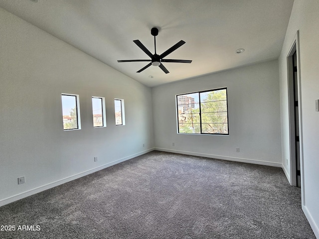 1401 S Rita Ln, Tempe, AZ 85281 - unfurnished room with ceiling fan, dark colored carpet, and lofted ceiling