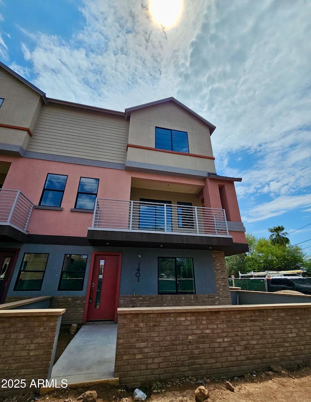 1401 S Rita Ln, Tempe, AZ 85281 - view of front of house featuring a balcony and stucco siding