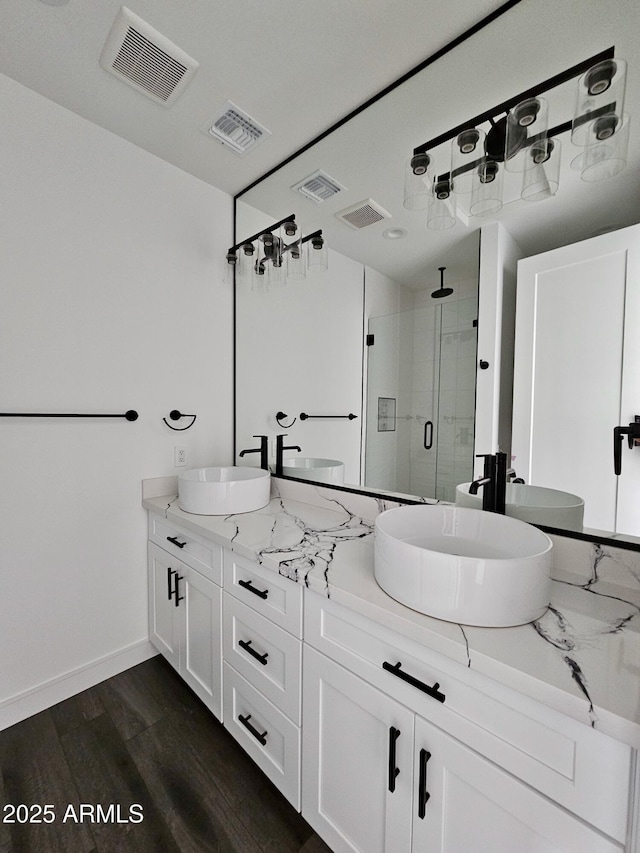 1401 S Rita Ln, Tempe, AZ 85281 - bathroom featuring a shower stall and double vanity