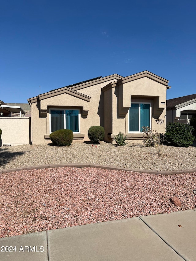 rear view of property with stucco siding