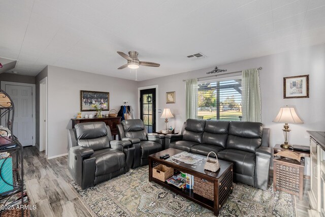7738 N 185th Ave, Waddell, AZ 85355 - living room with visible vents, light wood-style flooring, and ceiling fan
