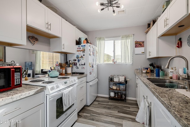 7738 N 185th Ave, Waddell, AZ 85355 - kitchen featuring visible vents, a sink, a wealth of natural light, and white appliances