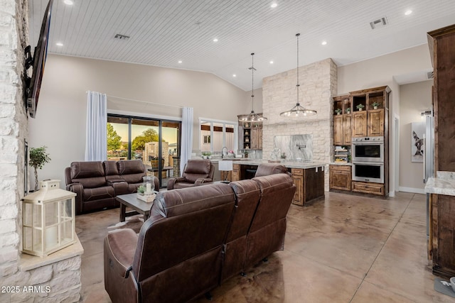 7738 N 185th Ave, Waddell, AZ 85355 - living area featuring visible vents, recessed lighting, finished concrete flooring, and high vaulted ceiling