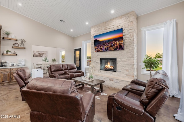 7738 N 185th Ave, Waddell, AZ 85355 - living area featuring visible vents, a stone fireplace, high vaulted ceiling, recessed lighting, and wooden ceiling