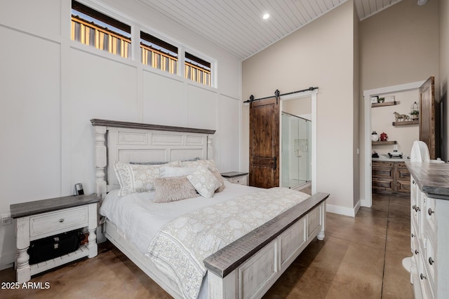 7738 N 185th Ave, Waddell, AZ 85355 - bedroom with a barn door, high vaulted ceiling, baseboards, wooden ceiling, and finished concrete floors