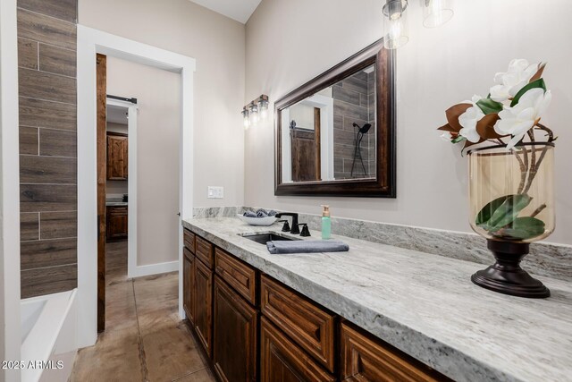 7738 N 185th Ave, Waddell, AZ 85355 - bathroom featuring vanity, baseboards, and a tub
