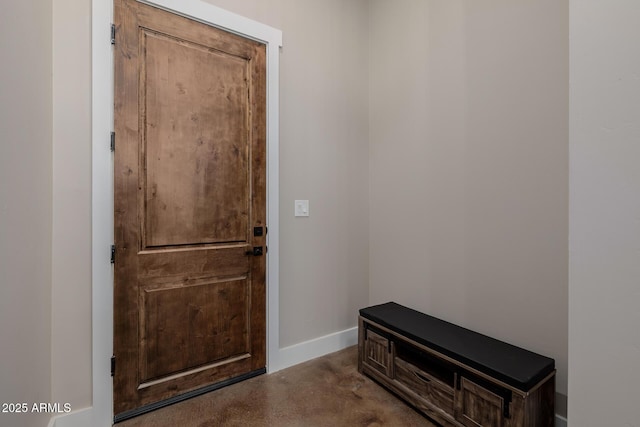 7738 N 185th Ave, Waddell, AZ 85355 - doorway to outside featuring baseboards and finished concrete flooring