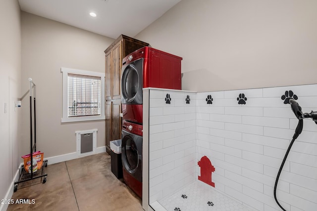 7738 N 185th Ave, Waddell, AZ 85355 - laundry room with cabinet space, recessed lighting, baseboards, and stacked washer and clothes dryer